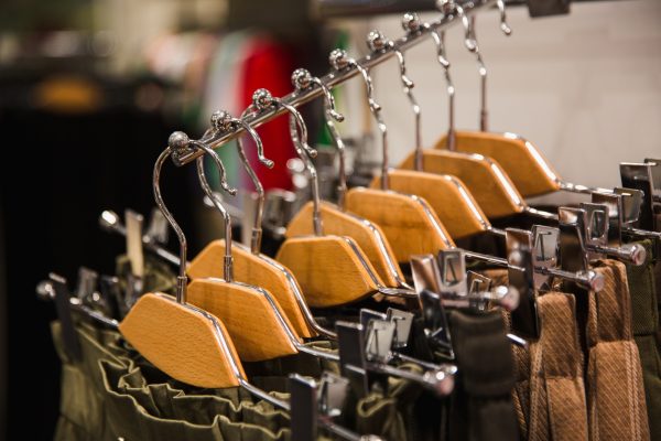 Different clothes on hangers, close up